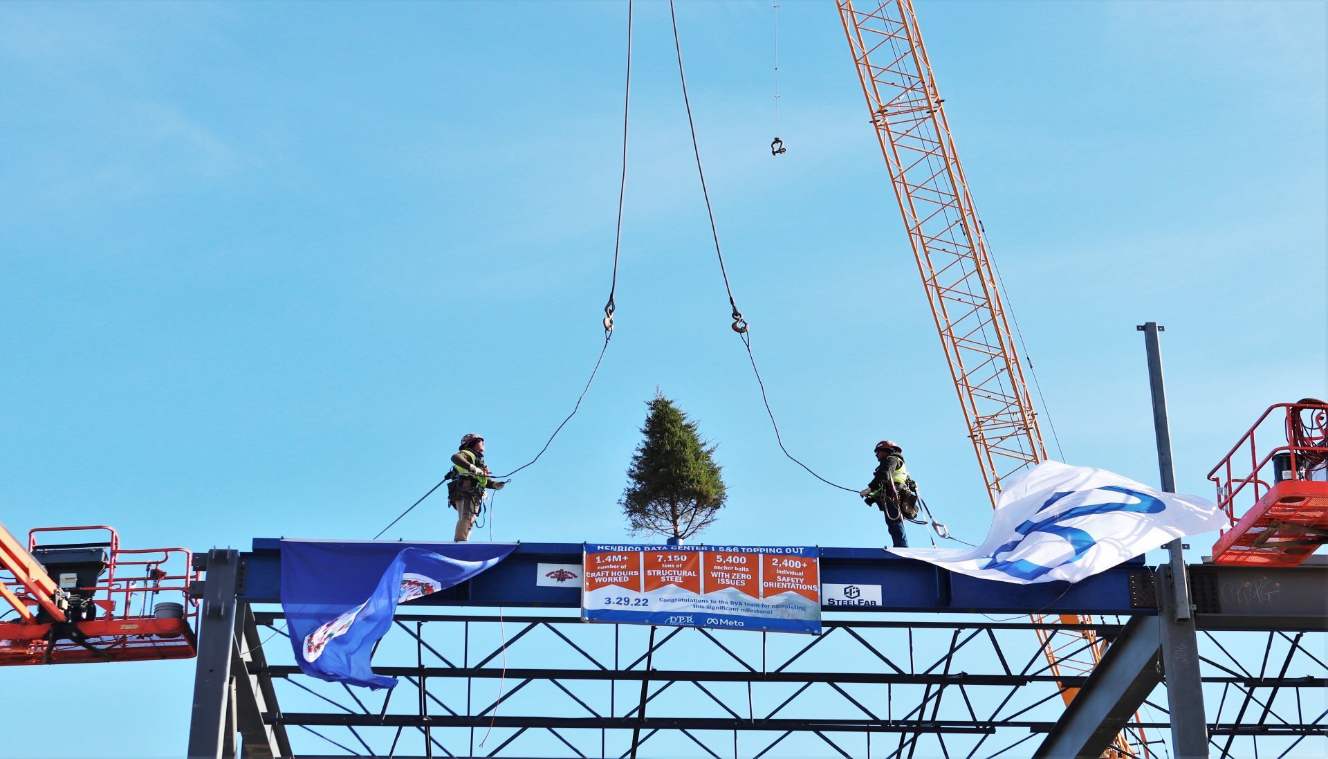 The final beam being lifted into place.