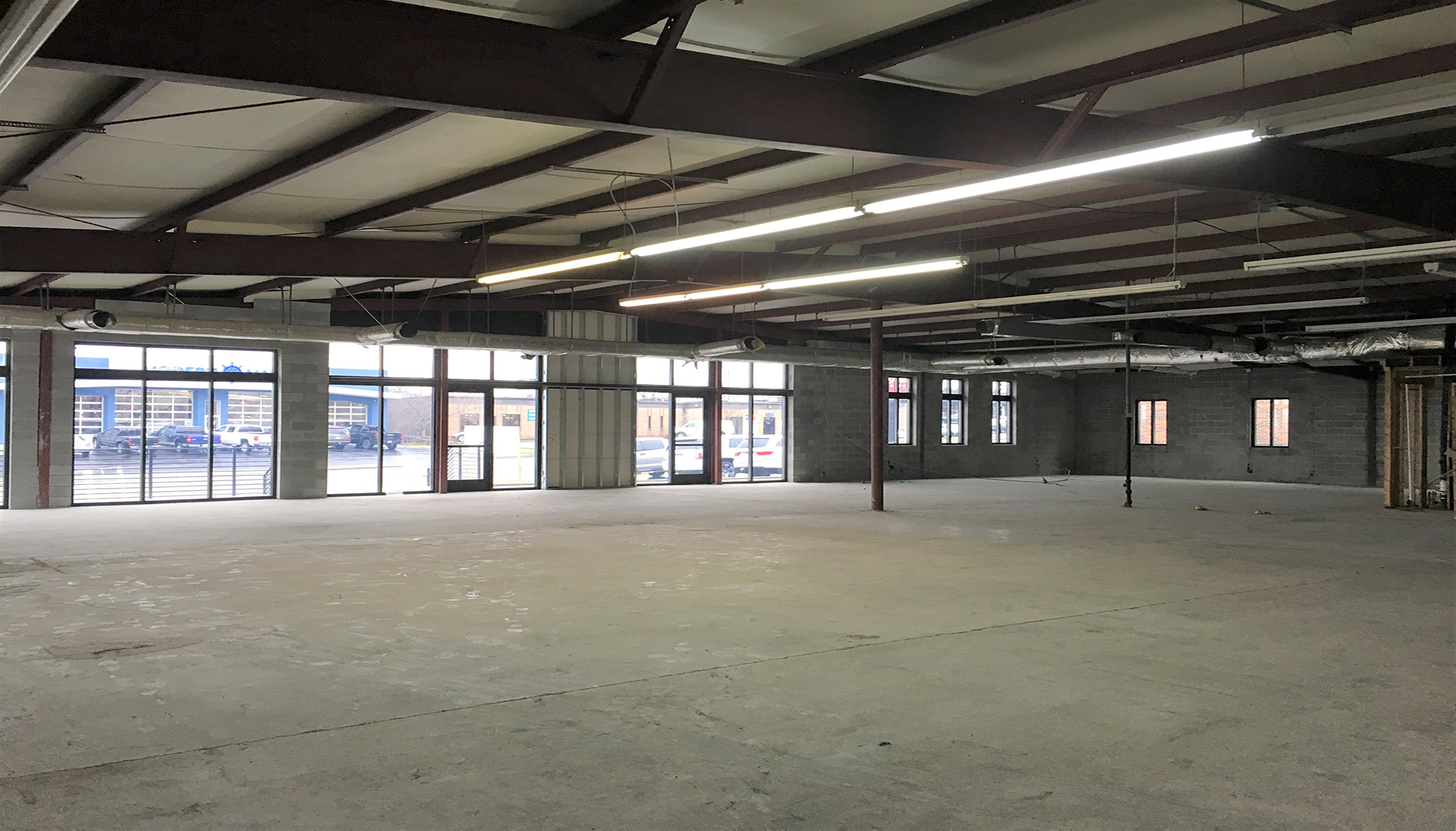 Interior of empty warehouse space before construction.