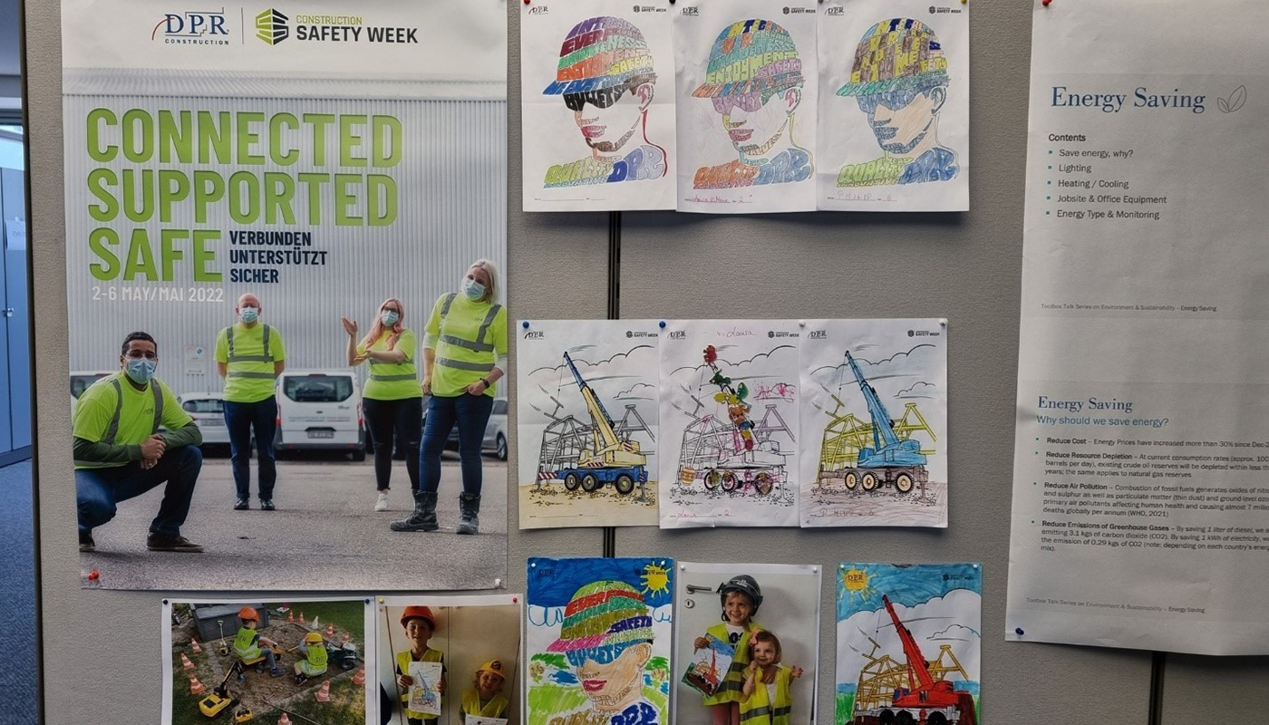 A bulletin board shows a Safety Week banner, photos of children and coloring pages.